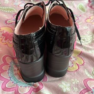 Pink and black clog heels